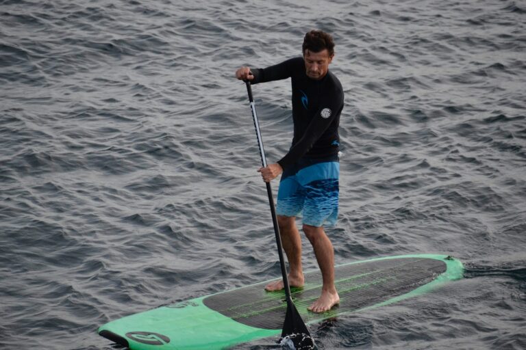 Paddle boarding on a lake.