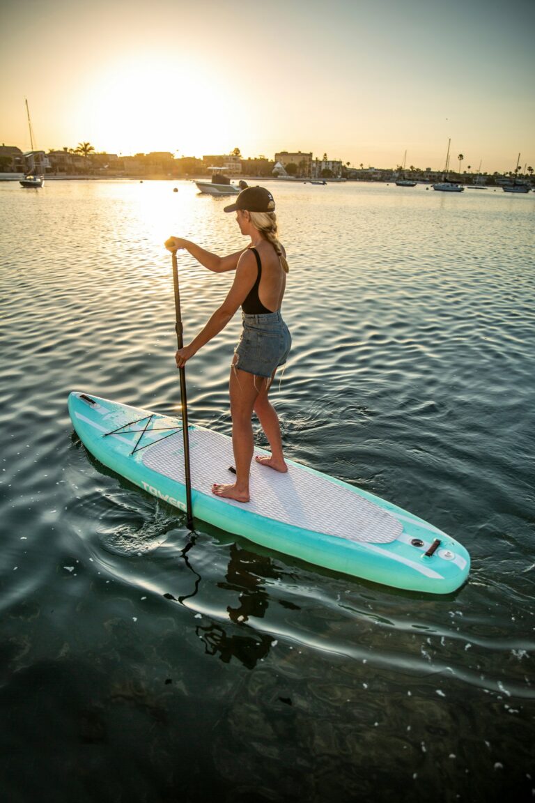 Woman holding a paddle board paddle